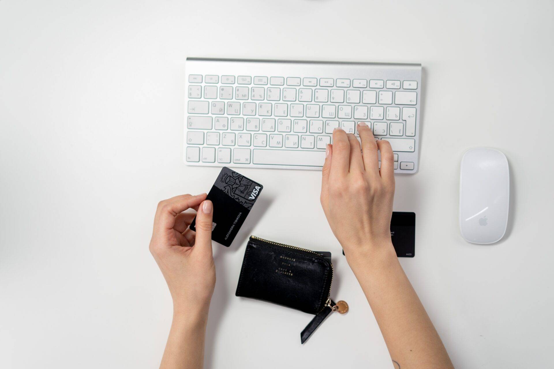 A Person shopping online with a credit card.