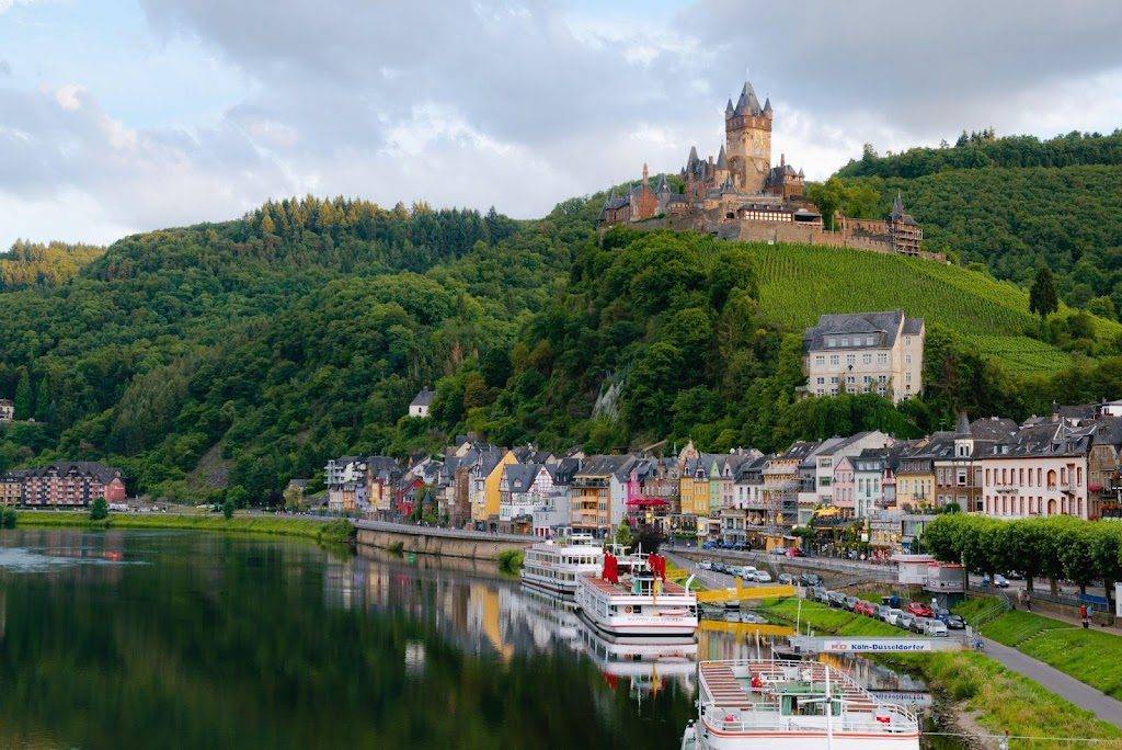 Beautiful European background with a hill, lake, and castle.